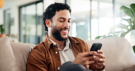 Man, relax and laugh on sofa with phone, social media and meme website for joke in home. Person,...