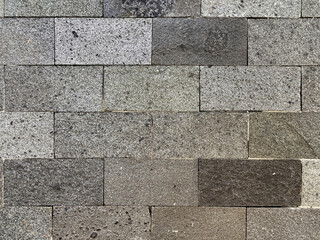 Close up of flat andesite slate stone or grey paving stone. Suitable for wall finishes, cladding,...