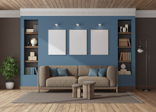 Modern living room interior with blue wall and wooden ceiling showing three blank canvases