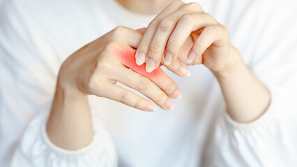 Wrist pain chronic therapy concept. Delicate hands gently resting, showcasing soft skin and natural nails.