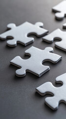 Obraz premium Puzzle pieces on dark surface symbolize path to success through problem solving and creativity