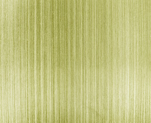 Golden texture of shiny scratched metal. Abstract metallic background.