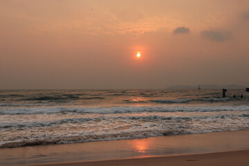 Fototapeta premium Beautiful red and orange sunrise over the sea at Laem Son Beach, Thailand.