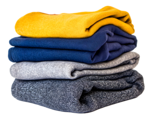 Neatly folded pile of colorful sweaters with yellow, navy, gray and speckled blue material