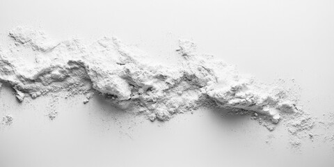 Abstract close-up: delicate white powder drifts across a textured surface, creating a soft, blurred depth