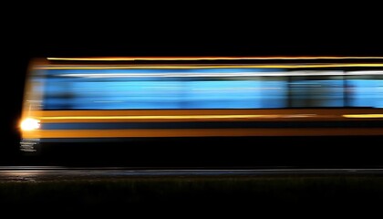 A fast moving train at night with long exposure lights