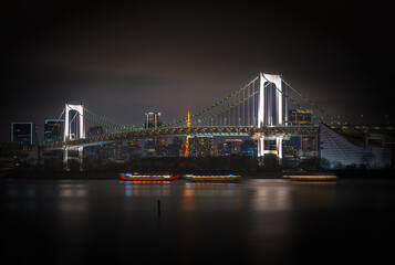 Japan- Kanto Region- Tokyo- Long exposure of Tokyo Bay and Rainbow Bridge at dusk