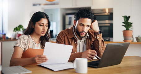Finance, laptop and couple in home with discussion for paperwork, bankruptcy or stress for debt. Document, man and woman in kitchen with bills, tax expenses and planning budget with payment notice