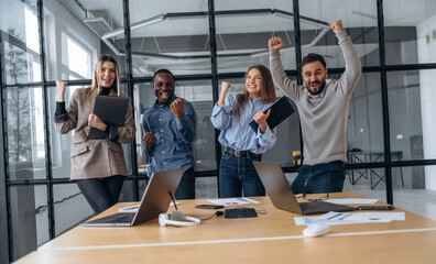 Amazing success, happy. Professional workers are in the modern office together