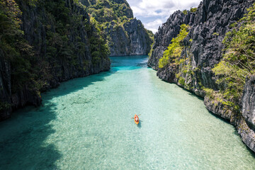 Travel background with lagoon and kayak in tropical islands of Philippines