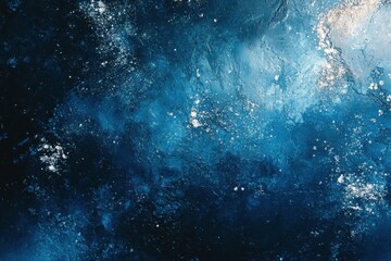 Fototapeta premium Deep blue, textured surface with white specks and slight marbling effect. Good for backgrounds, textures, or abstract designs with calming tones.