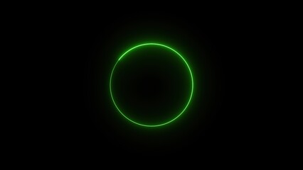 Glowing green neon circle on black background.