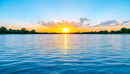 Fototapeta premium Serene sunset over calm lake waters, vibrant colors reflecting on the surface