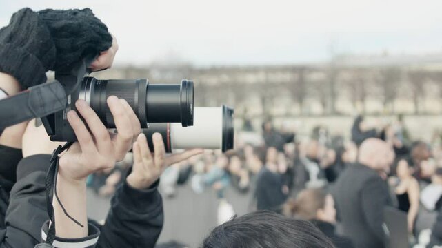 Press photographer capturing climate change protest in paris