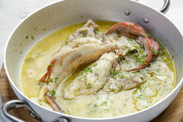 Scorpion Fish (Skorpina) steamed in a lemon sauce with potatoes	
