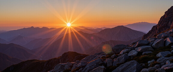 Sunrise casting warm glow over mountain peaks, nature's awakening