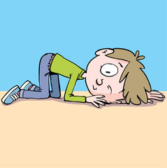 boy listens to the sound in the distance with his ear resting on the ground