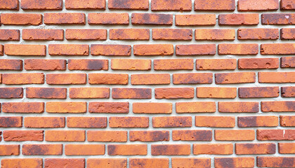 Obraz premium Textured brick wall with natural colors and soft lighting, architectural detail