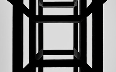 A geometric design featuring a series of black frames, viewed from below, creating a striking visual perspective.