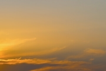 Yellow orange golden sky with fluffy cloud. Summer sunset nature landscape. Beautiful sunrise background. Cloudscape gradient abstract. Sunset sunrise backgrounds.