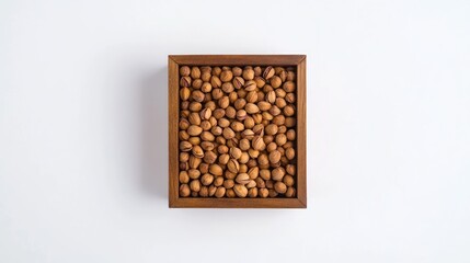 Pistachios in wooden box on white background.  Possible use Food photography