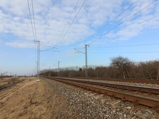 Two way railroad tracks in countryside. Two railway tracks. Sunny day. Countryside. Fields and...