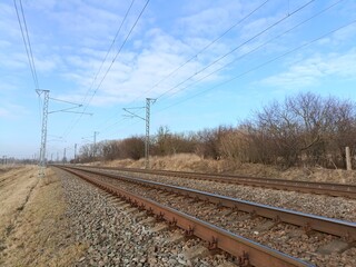 Two way railroad tracks in countryside. Two railway tracks. Sunny day. Countryside. Fields and...