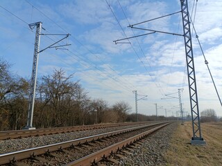 Two way railroad tracks in countryside. Two railway tracks. Sunny day. Countryside. Fields and...