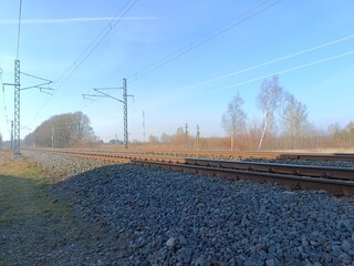 Two way railroad tracks in countryside. Two railway tracks. Sunny day. Countryside. Fields and...