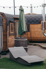 Small summer country house in with deck chair in the courtyard