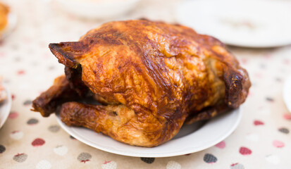 Whole roasted chicken on a plate