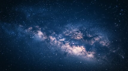 Fototapeta premium A vast starry night blankets the sky, revealing the Milky Way's luminous expanse above, as cosmic wonders unfold in a celestial display of majestic beauty.