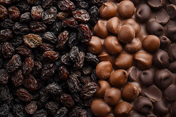 Obraz premium Variety of Dried Fruits and Chocolates. National Chocolate Covered Raisins Day.