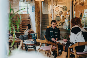 A group of individuals enjoying a relaxed atmosphere in a stylish coffee shop. The scene captures conversations, comfort, and aesthetic design.