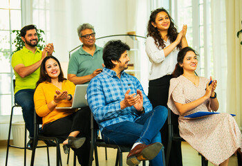 Indian Young business professionals gathering for corporate training session in professional office