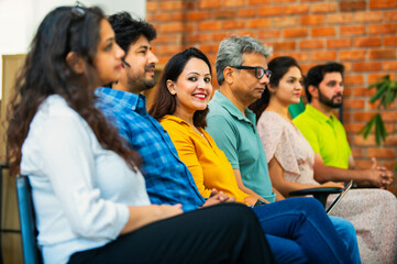 Indian Young business professionals gathering for corporate training session in professional office