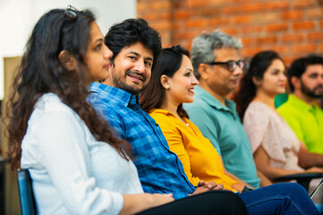 Indian Young business professionals gathering for corporate training session in professional office