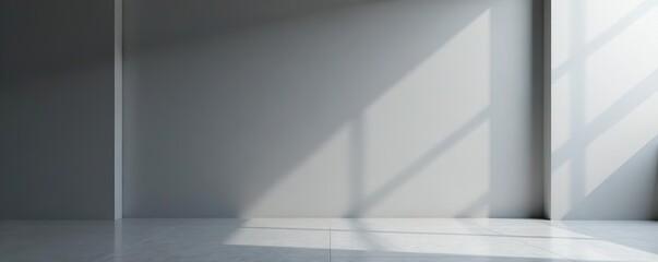 Obraz premium Gray minimalist studio backdrop with clean lines and soft lighting, seamless, contrast