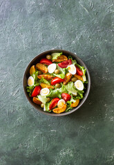 Salad with potatoes, tomatoes, olives and eggs. Healthy food. Vegetarian food.
