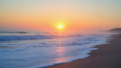 Fototapeta premium The ocean is calm and the sun is setting, creating a beautiful