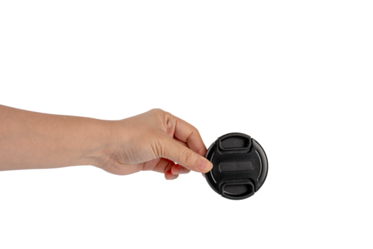 Camera Lens Cap in hand, isolated on transparent background. - Powered by Adobe