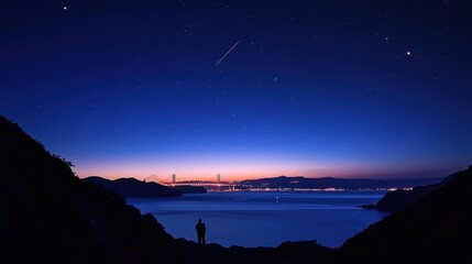 The Golden Gate Bridge at twilight, with the first stars of the evening visible above, creating a serene and picturesque moment over San Francisco Bay