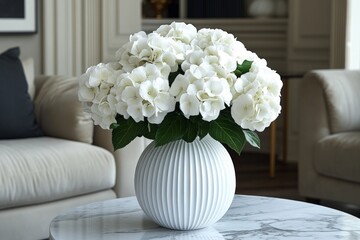 Beautiful white hydrangeas in a decorative vase placed on a marble table in a stylish living room
