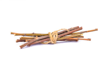 Dry branches, twigs isolated on white background, branch tied together, bundle of firewood, pieces of collected small dry tree branches or twigs, isolated in white background, different angle view