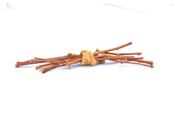 Dry branches, twigs isolated on white background, branch tied together, bundle of firewood, pieces of collected small dry tree branches or twigs, isolated in white background, different angle view