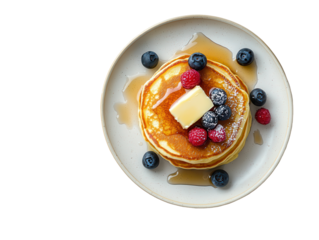 Isolated Pancakes with Berries and Maple Syrup