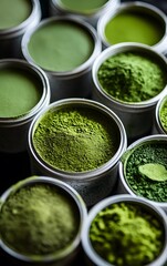 Obraz premium A closeup shot of matcha grades in containers, with natural light highlighting their texture