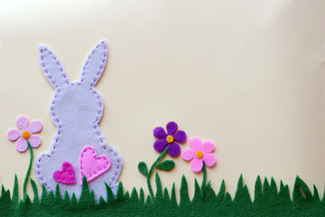 Felt bunny and spring flowers, Easter handmade decoration, DIY craft project, colorful floral meadow, fabric sewing, green grass, festive textile art, home decor, creative design