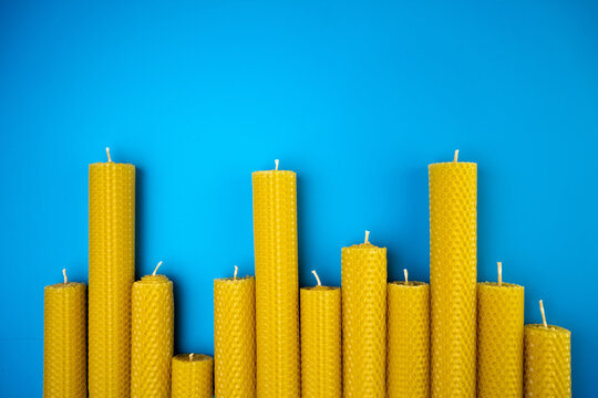 Cryptocurrency uptrend and downtrend stock price chart volatility investor sentiment fluctuations beeswax candles on blue background