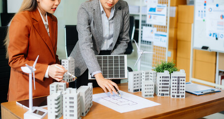 Professionals for a greener future. Showcasing renewable energy solutions with solar panels, wind...